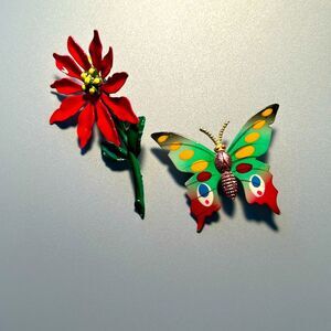 Vintage pointsettia and butterfly enamel on metal brooch set